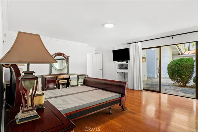 a bedroom with furniture and a window