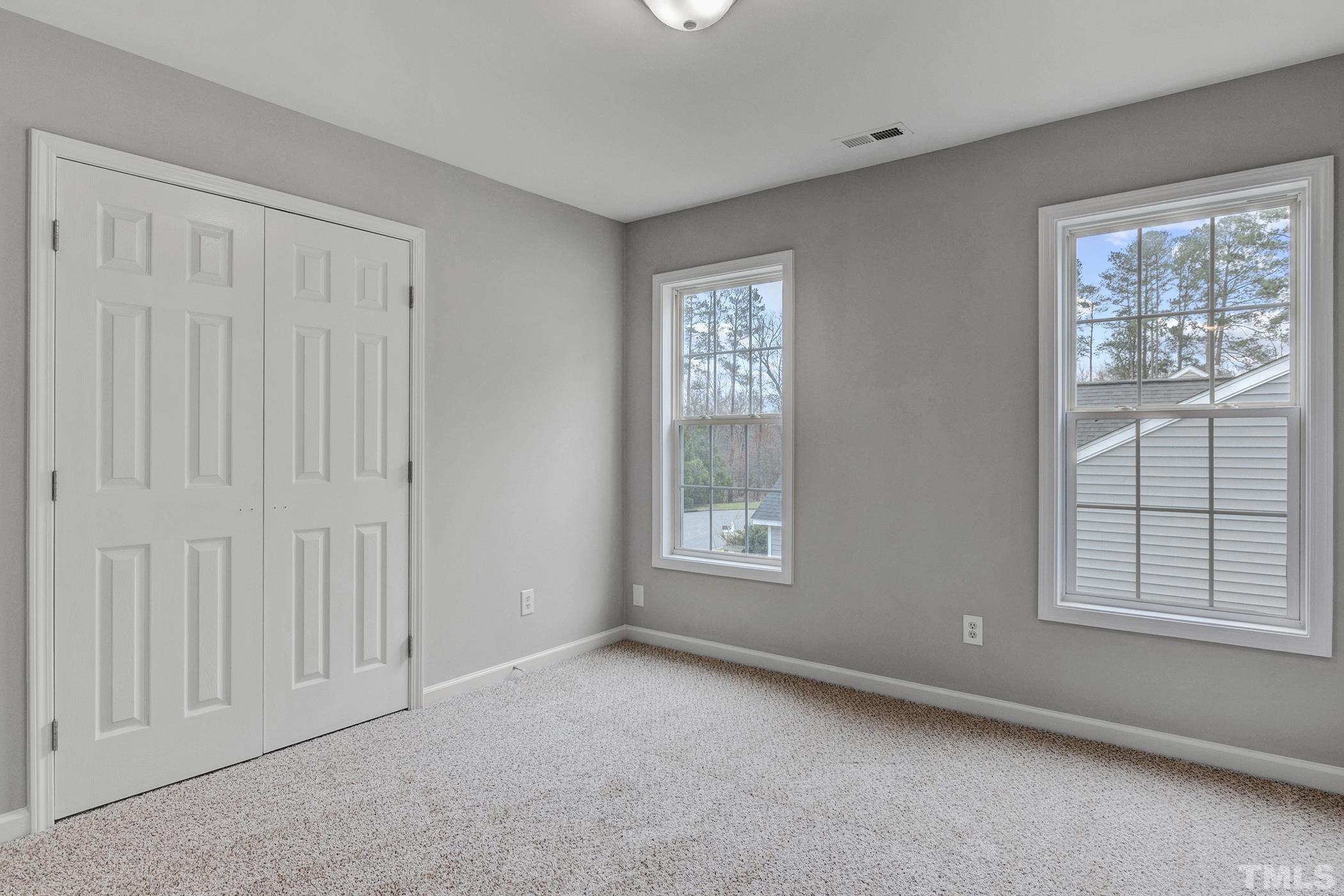 820 Nightshade Way Raleigh, NC 27610 - Photo 26 of 32 an empty room with windows