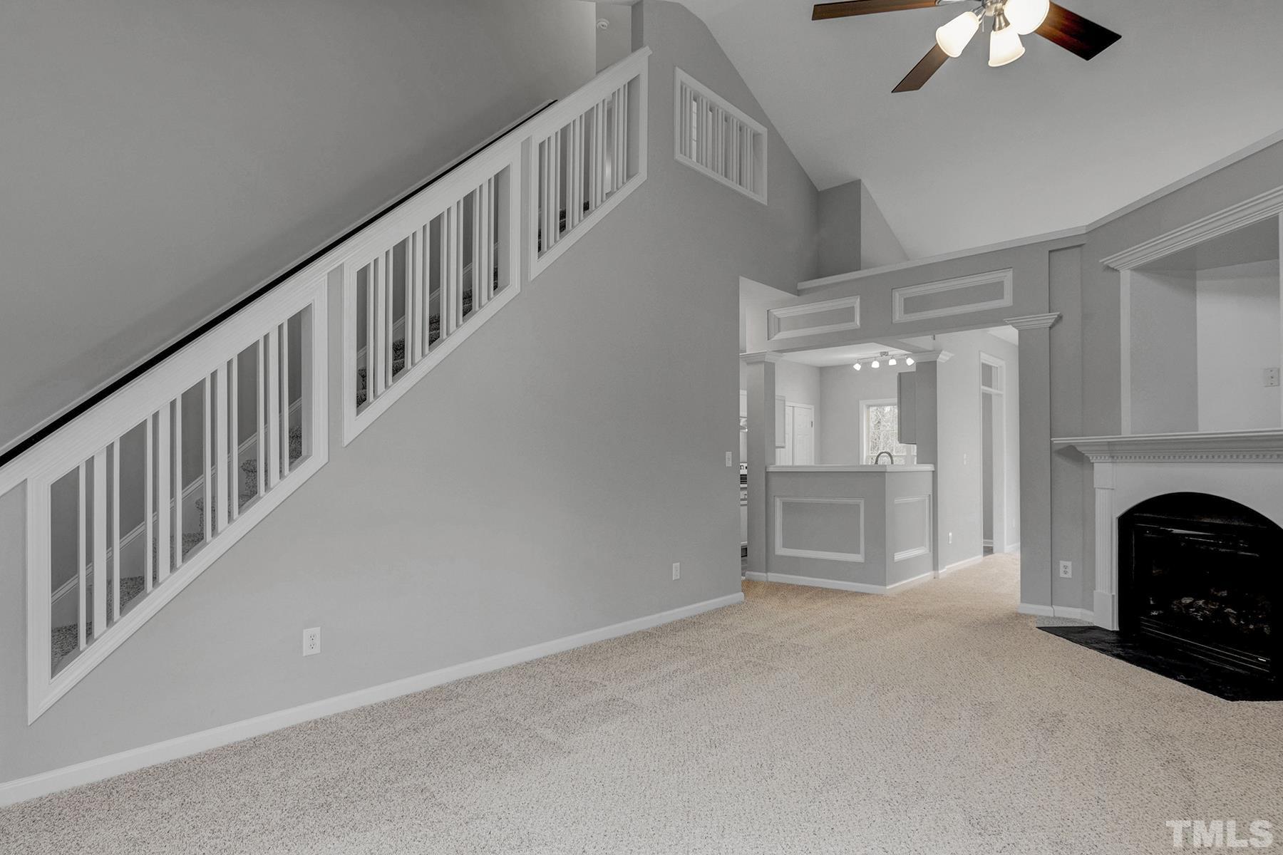 820 Nightshade Way Raleigh, NC 27610 - Photo 7 of 32 a view of empty room with fireplace and fan