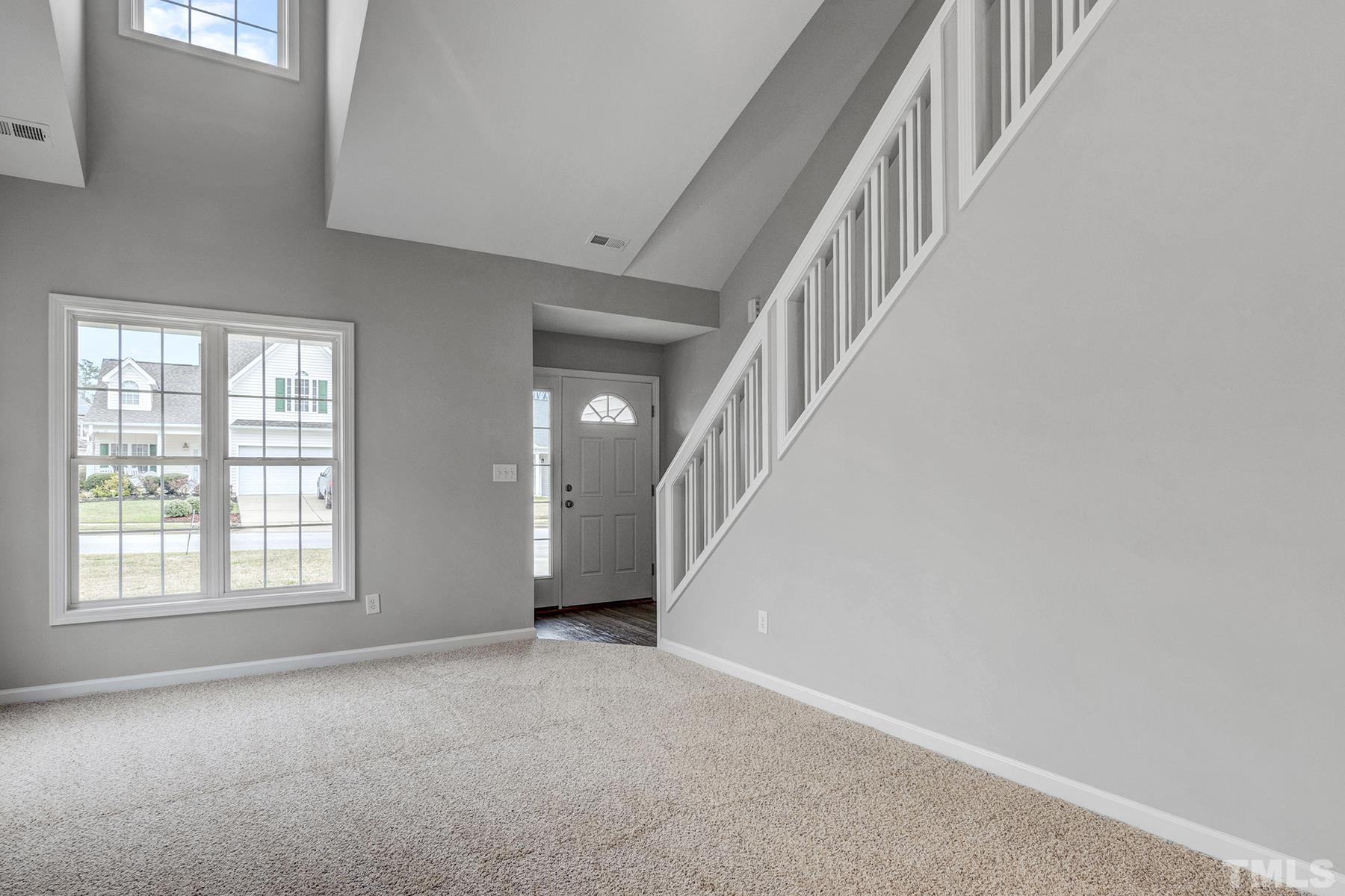 820 Nightshade Way Raleigh, NC 27610 - Photo 8 of 32 a view of an empty room with staircase