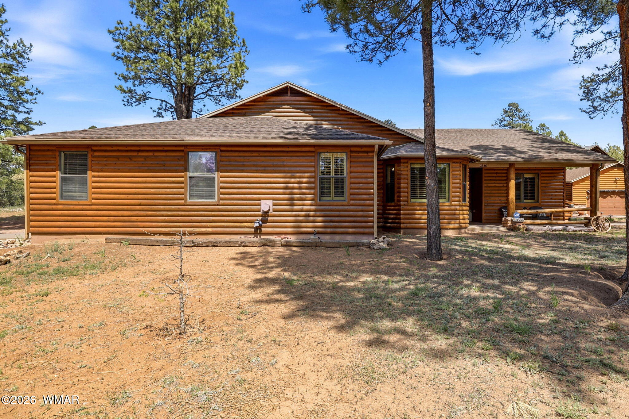 2236 Roundabout Way Overgaard, AZ 85933 - Photo 39 of 45 a front view of a house with a yard