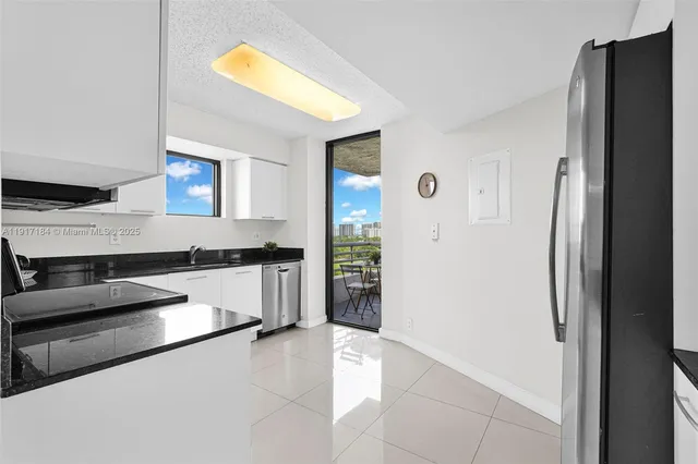 a kitchen with stainless steel appliances a refrigerator and a stove