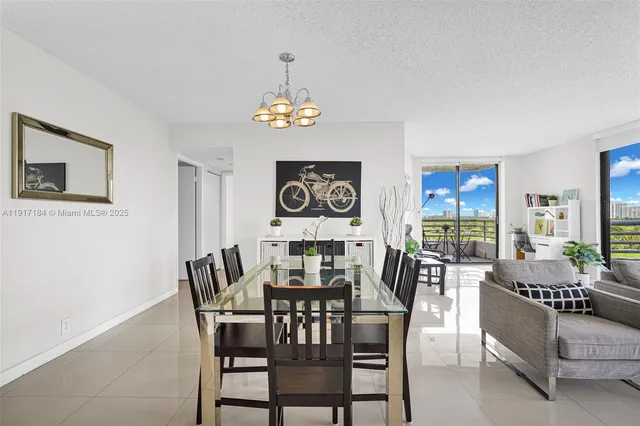 a view of a dining room with furniture wooden floor and chandelier