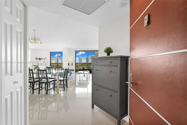 a room with furniture a dining table and chairs