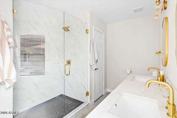 a bathroom with a tub sink and shower