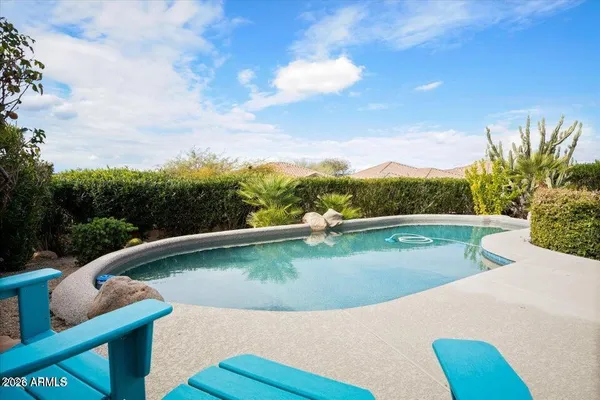 a view of a swimming pool with a terrace