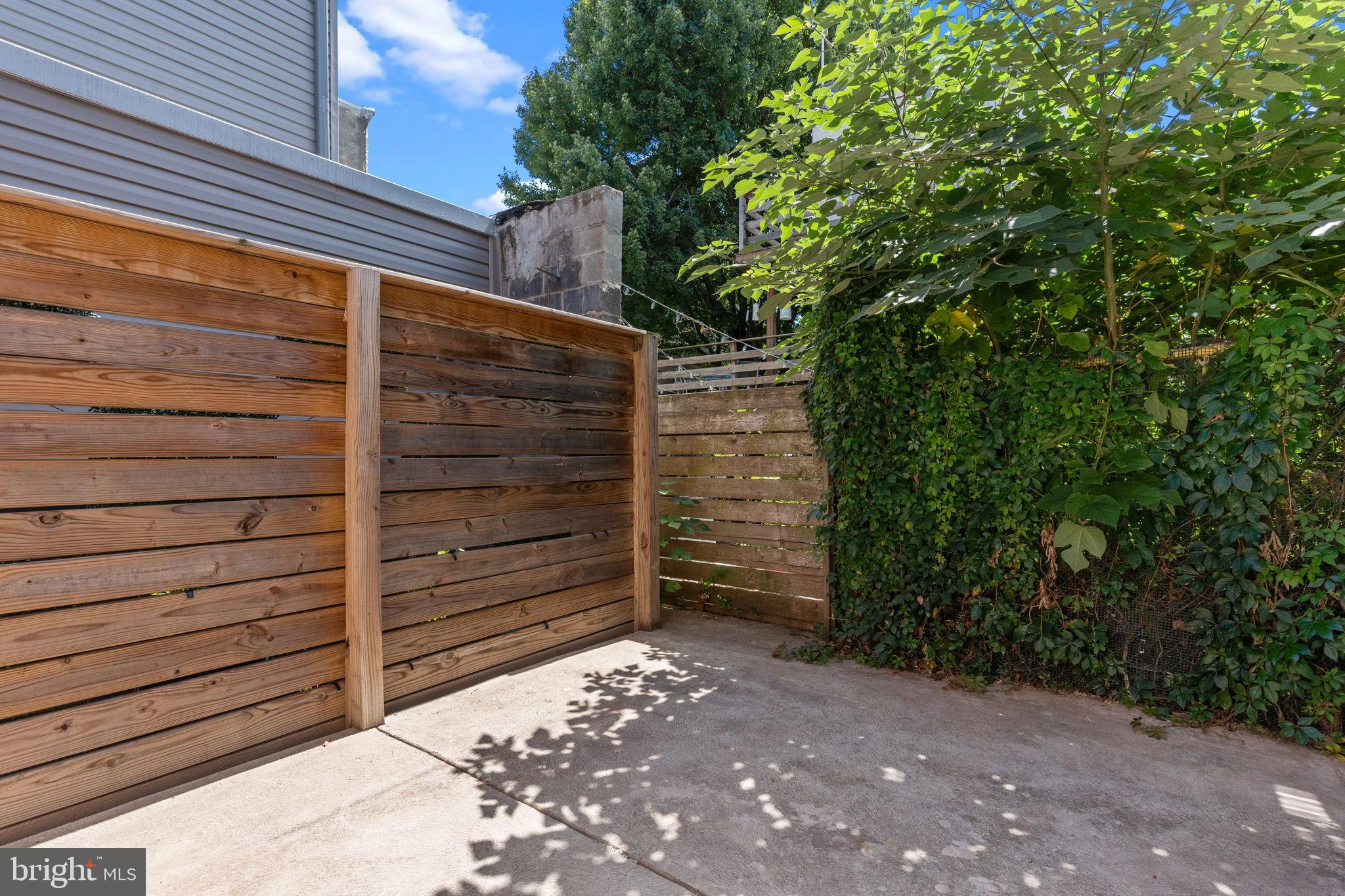 1307 Palethorp Street Philadelphia, PA 19122 - Photo 15 of 31 Private outdoor retreat with lush greenery.