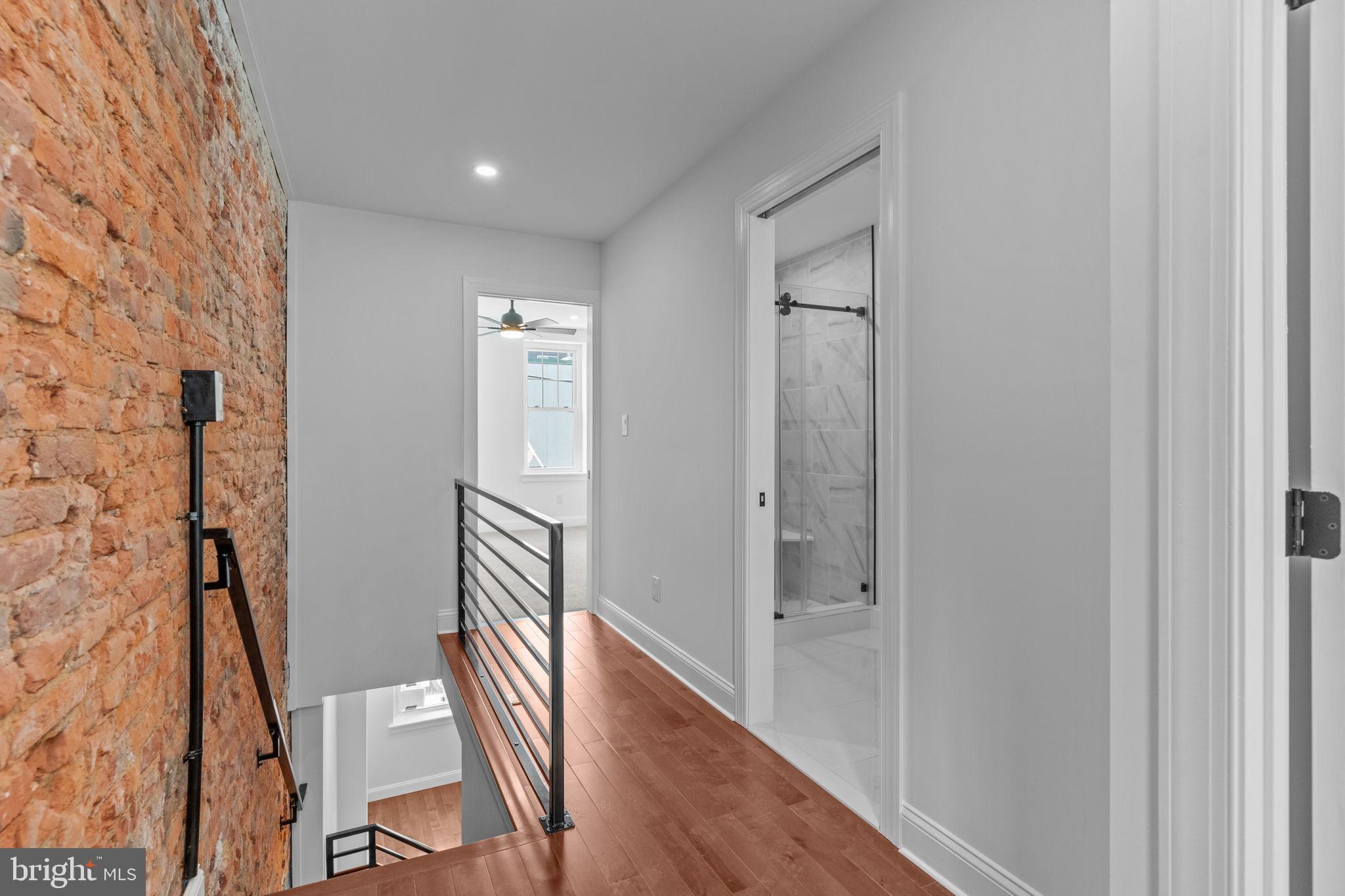 1307 Palethorp Street Philadelphia, PA 19122 - Photo 24 of 31 Modern hallway with exposed brick charm.