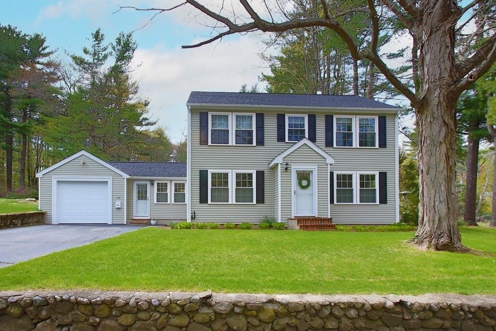 73 Moosehill Road Walpole, MA 02032 - Photo 1 of 21 a front view of a house with a garden