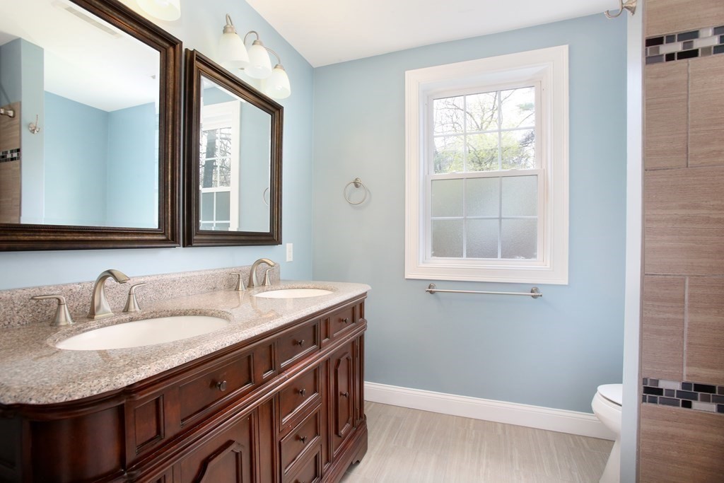 73 Moosehill Road Walpole, MA 02032 - Photo 15 of 21 a bathroom with a granite countertop sink and a mirror