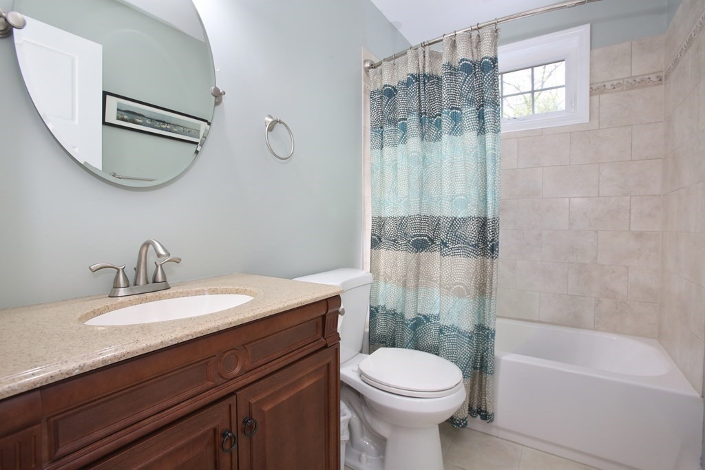 73 Moosehill Road Walpole, MA 02032 - Photo 17 of 21 a bathroom with a sink a toilet and a mirror