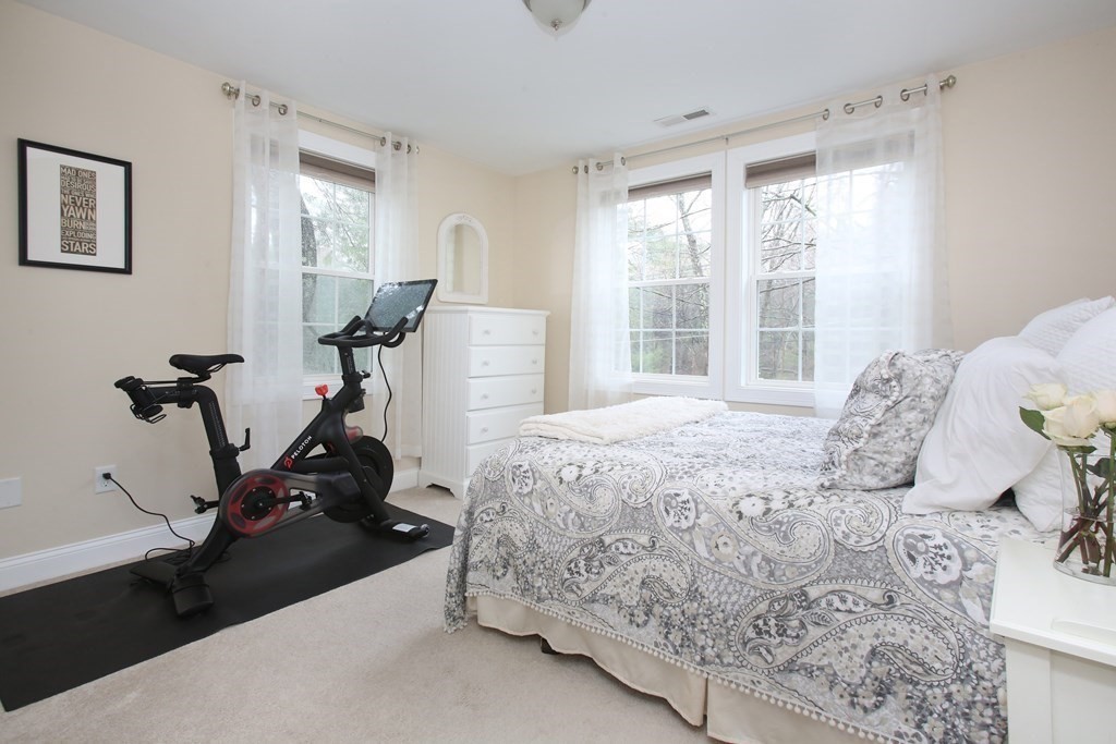 73 Moosehill Road Walpole, MA 02032 - Photo 19 of 21 a bedroom with a bed and wooden floor