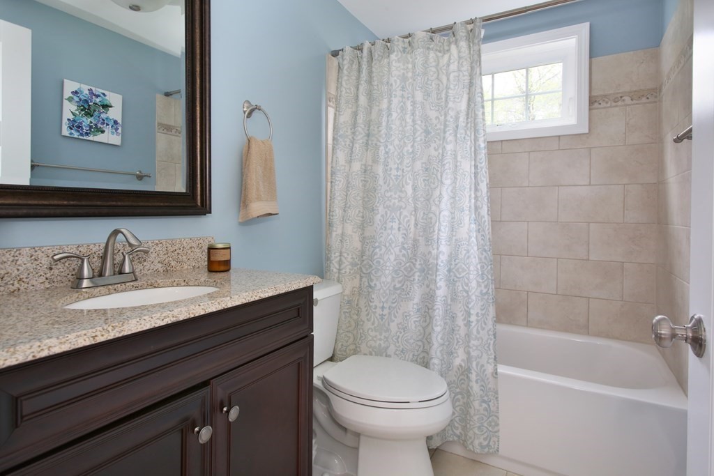73 Moosehill Road Walpole, MA 02032 - Photo 20 of 21 a bathroom with a granite countertop sink toilet a mirror and shower