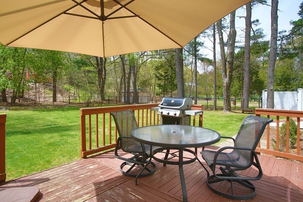 73 Moosehill Road Walpole, MA 02032 - Photo 3 of 21 a view of a patio with a table chairs and a yard