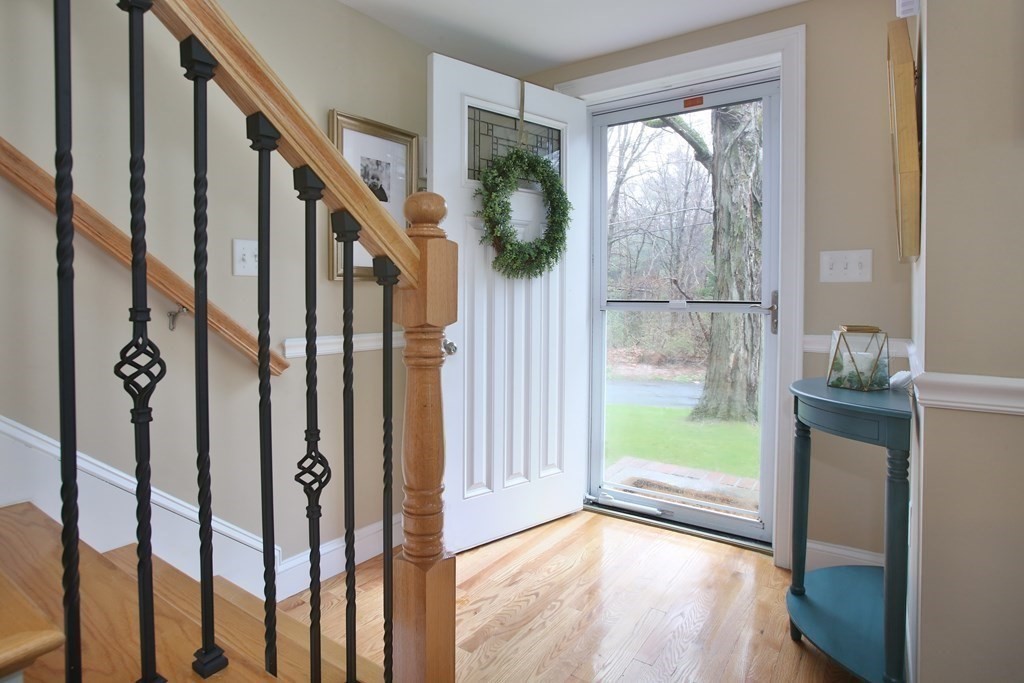 73 Moosehill Road Walpole, MA 02032 - Photo 4 of 21 a view of an entryway with wooden floor and door