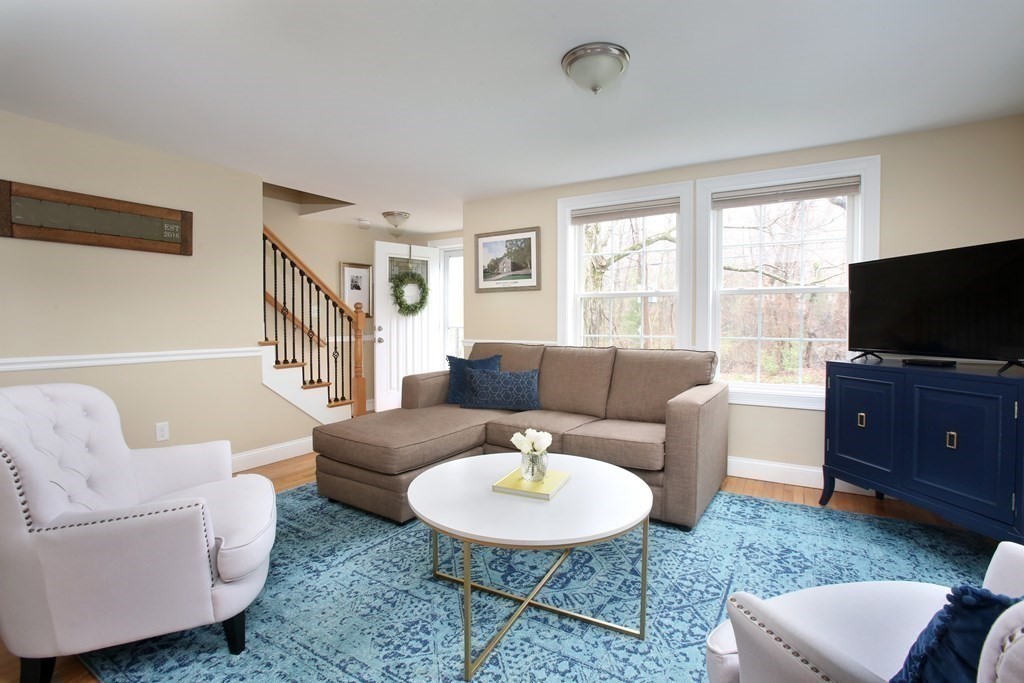 73 Moosehill Road Walpole, MA 02032 - Photo 5 of 21 a living room with furniture a flat screen tv and a window