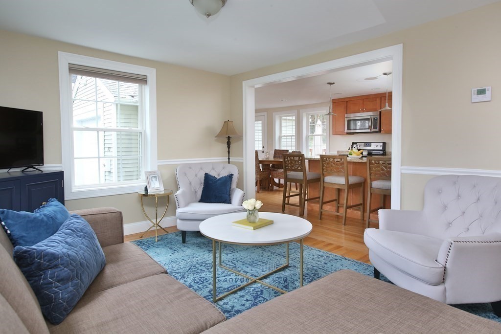 73 Moosehill Road Walpole, MA 02032 - Photo 6 of 21 a living room with furniture a flat screen tv and a window