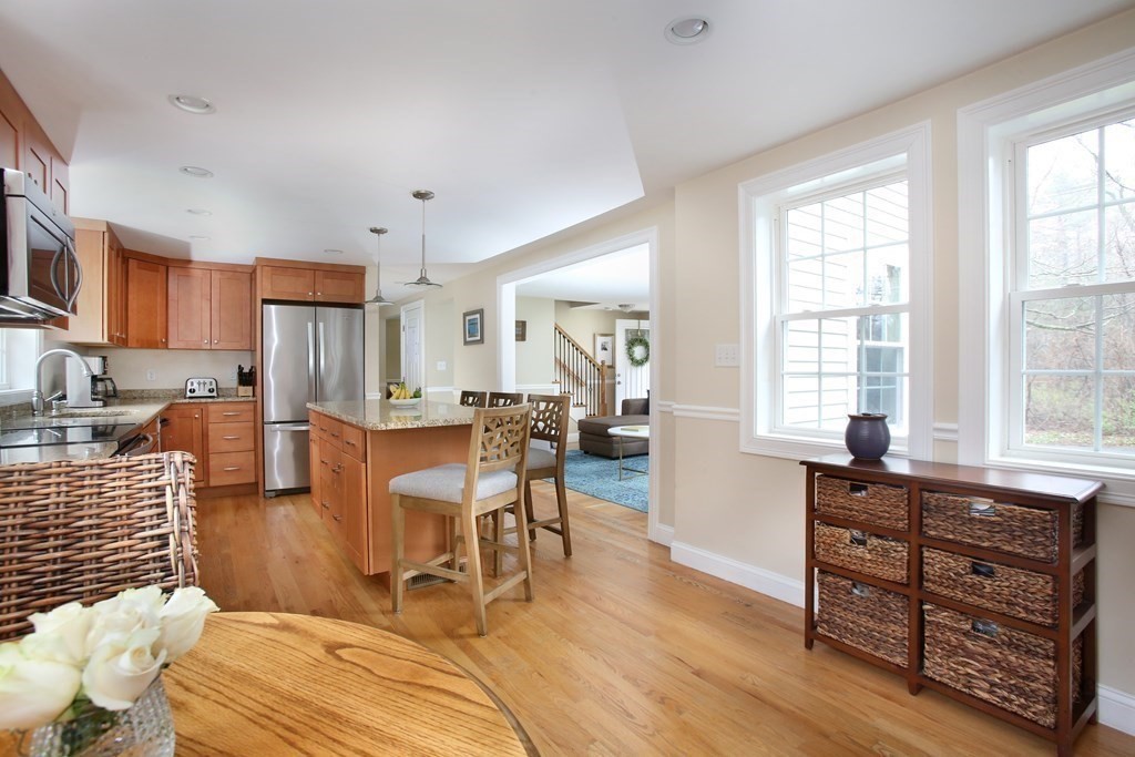 73 Moosehill Road Walpole, MA 02032 - Photo 7 of 21 a living room with furniture a dining table and wooden floor