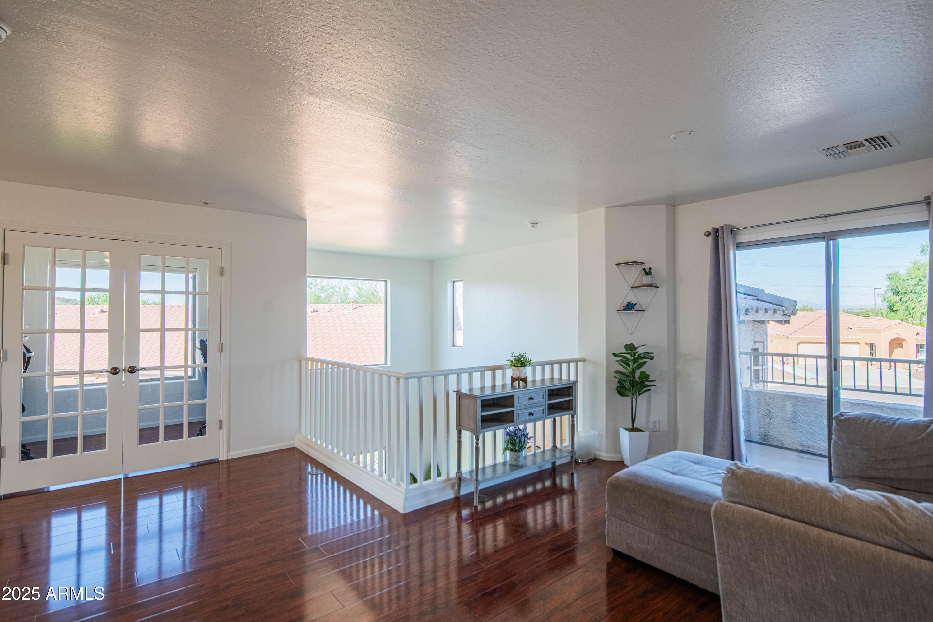 2831 East Jj Ranch Road Phoenix, AZ 85024 - Photo 13 of 32 a living room with furniture and a window