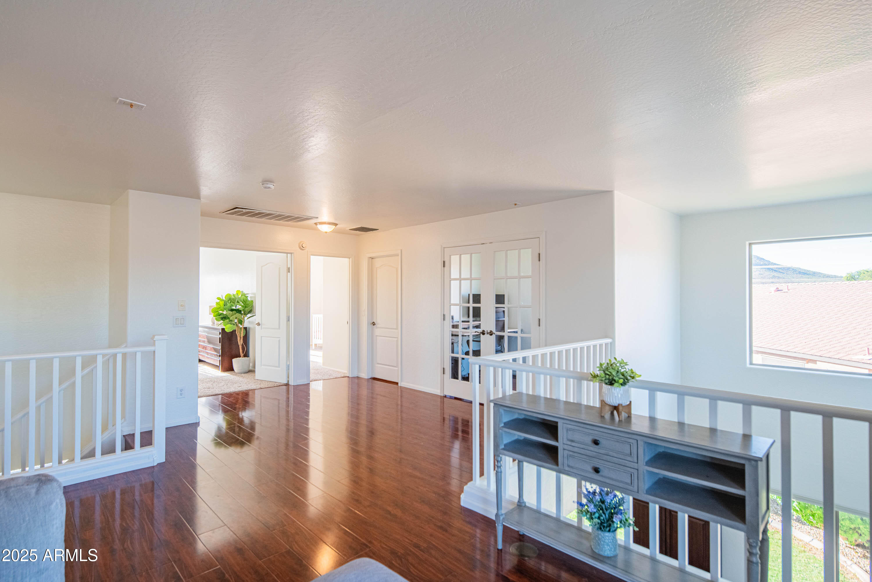2831 East Jj Ranch Road Phoenix, AZ 85024 - Photo 32 of 32 a living room with furniture and a wooden floor