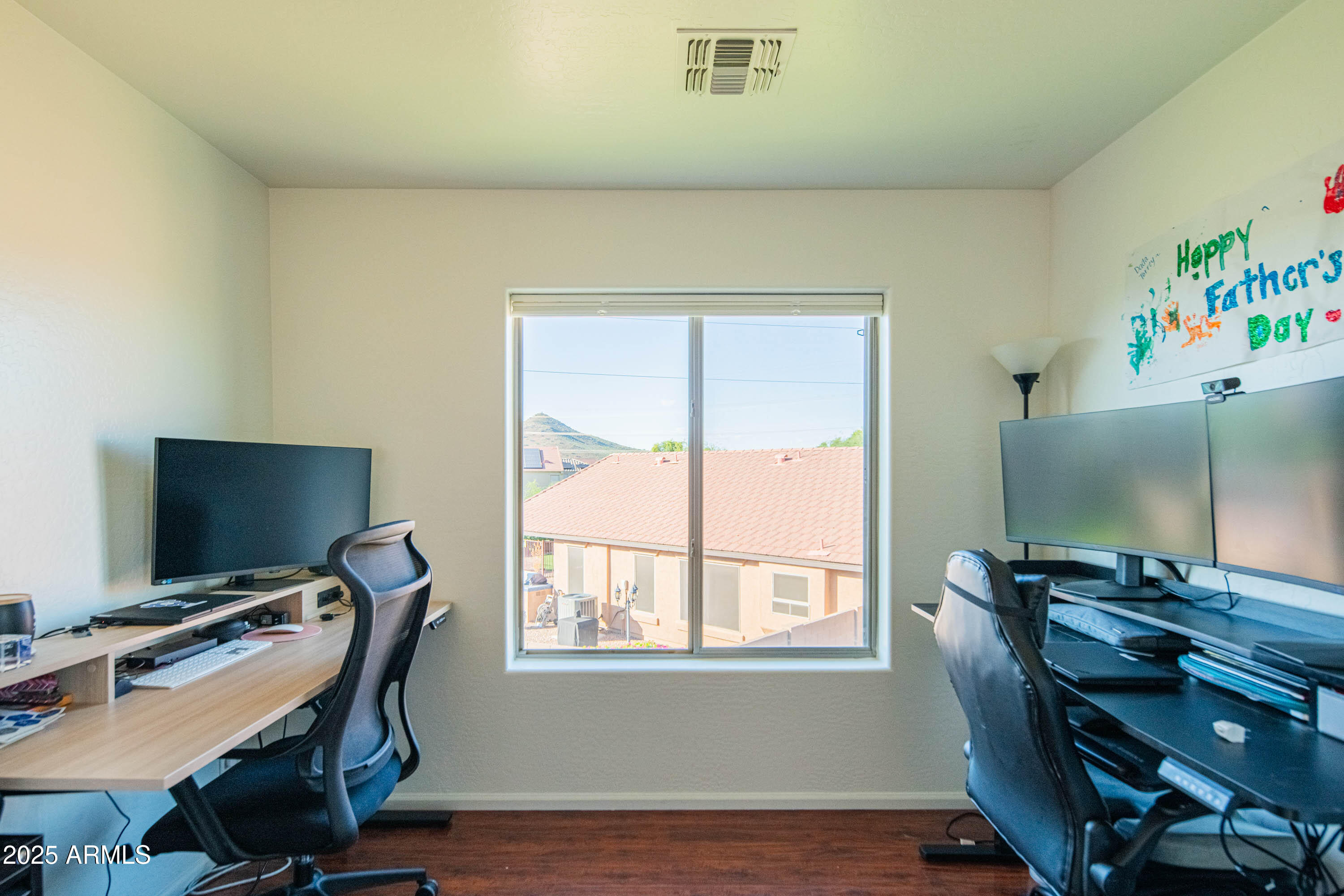 2831 East Jj Ranch Road Phoenix, AZ 85024 - Photo 14 of 32 a view of a workspace with furniture and a window