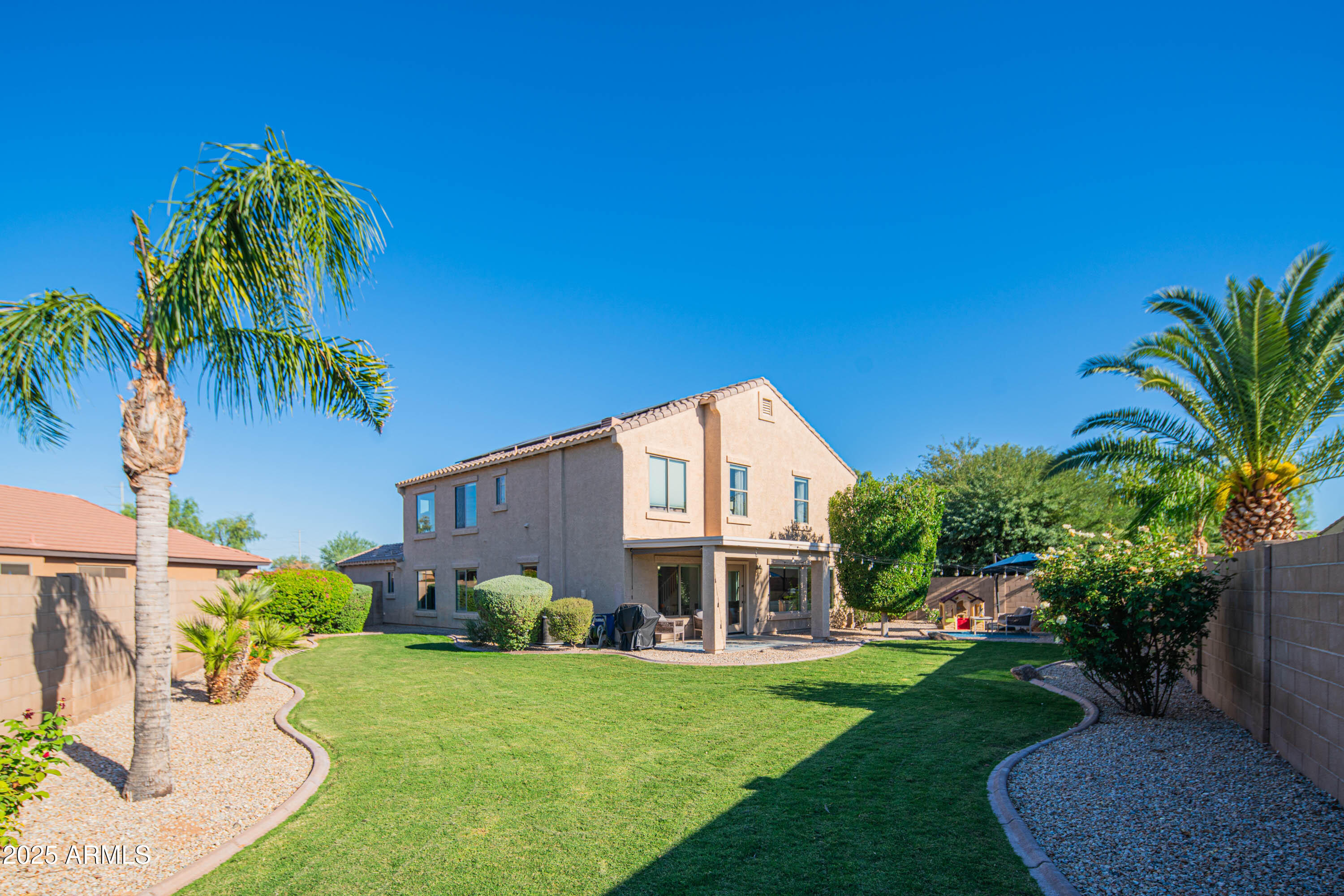2831 East Jj Ranch Road Phoenix, AZ 85024 - Photo 2 of 32 a front view of a house with a garden