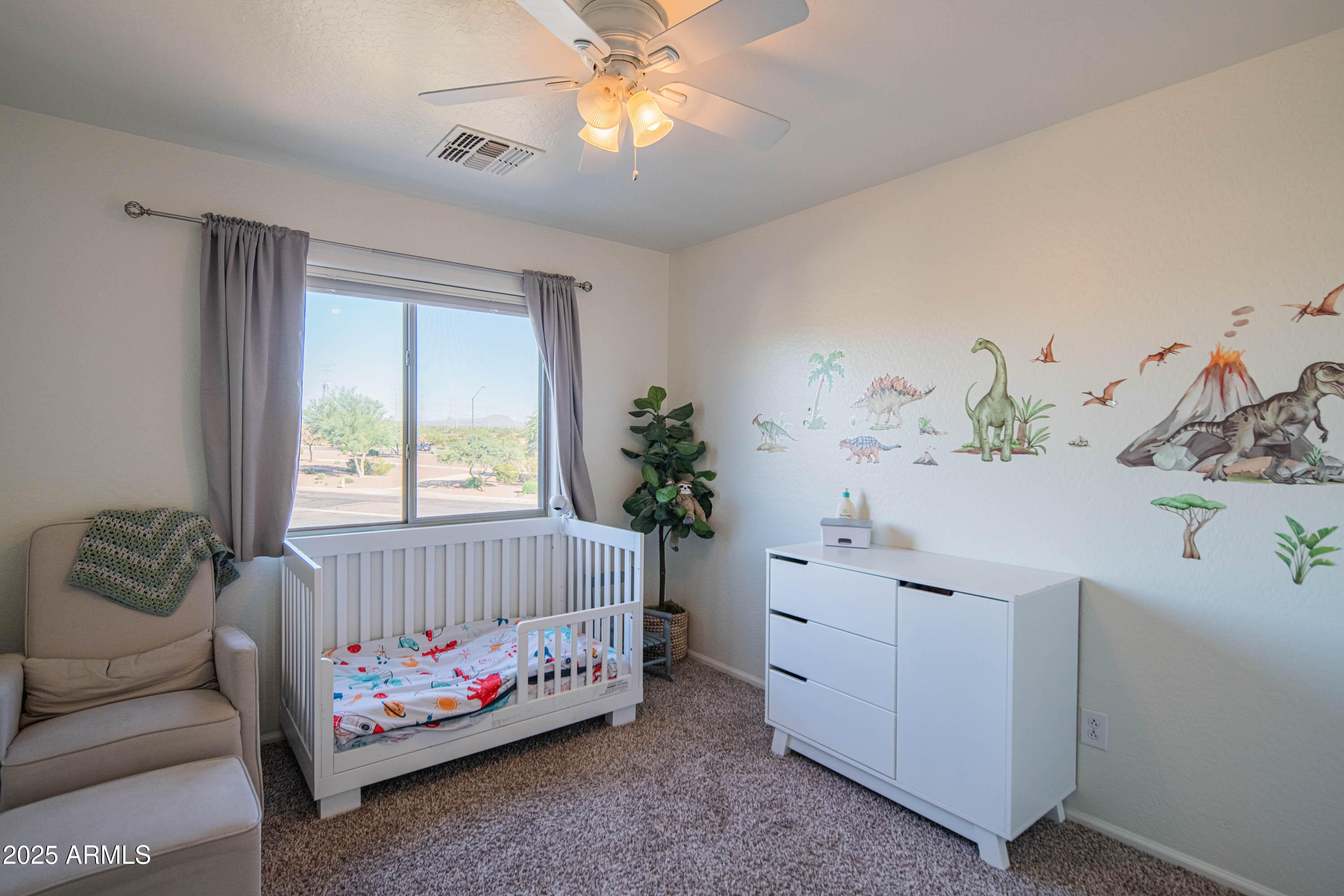 2831 East Jj Ranch Road Phoenix, AZ 85024 - Photo 21 of 32 a bedroom with a bed and a window