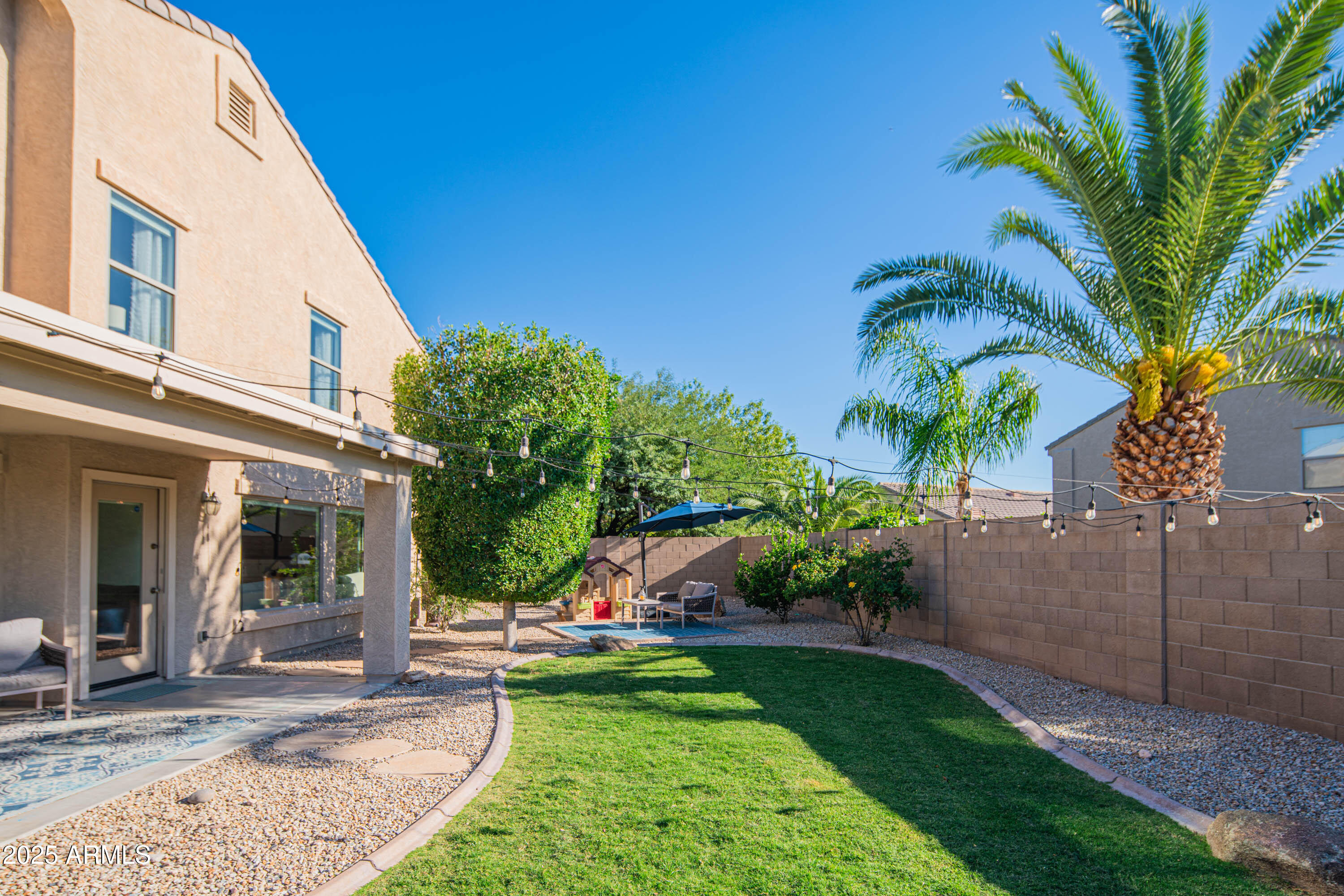 2831 East Jj Ranch Road Phoenix, AZ 85024 - Photo 23 of 32 a view of a house with a yard and potted plants