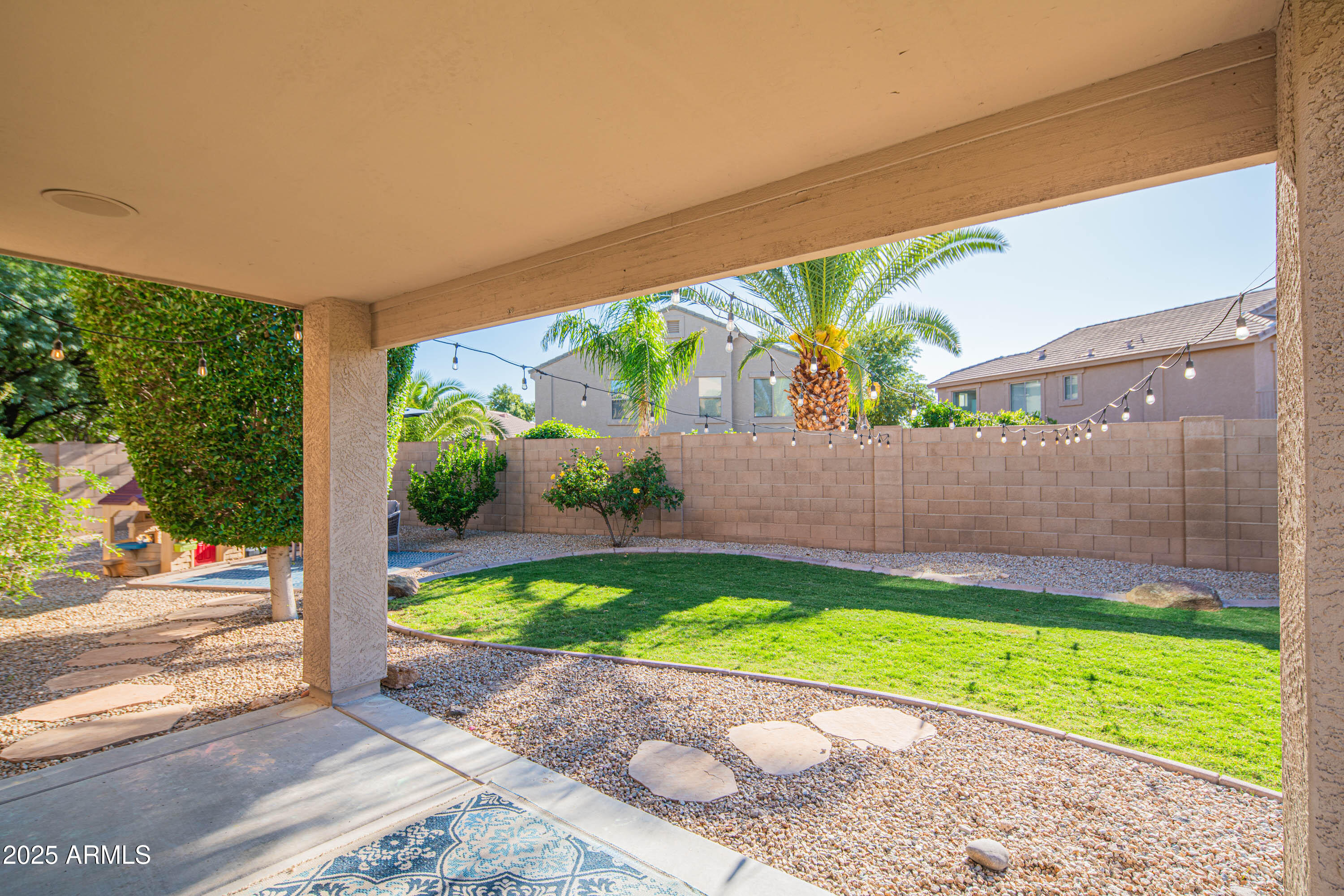 2831 East Jj Ranch Road Phoenix, AZ 85024 - Photo 24 of 32 a view of a backyard with a garden