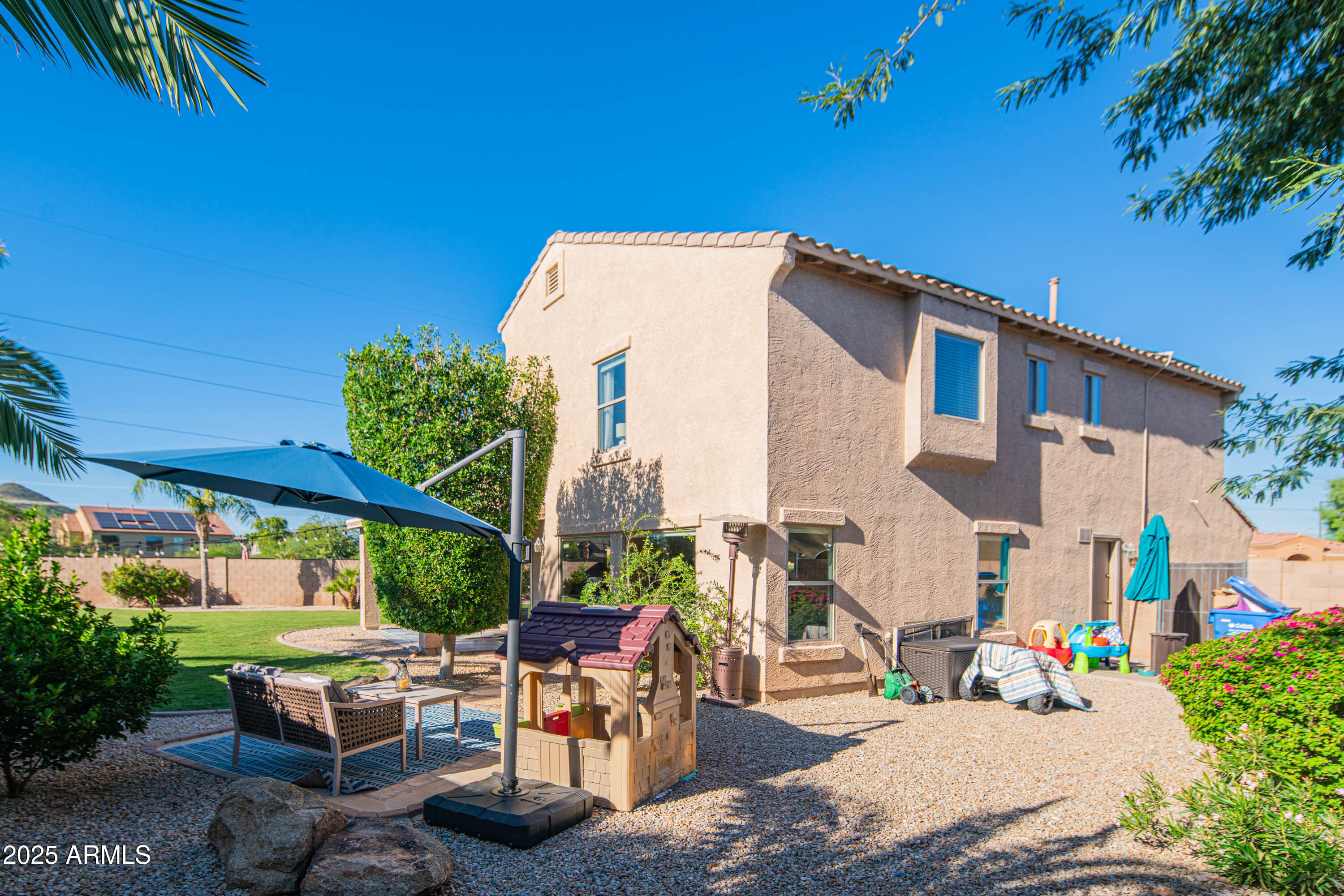 2831 East Jj Ranch Road Phoenix, AZ 85024 - Photo 29 of 32 a backyard of a house with outdoor seating