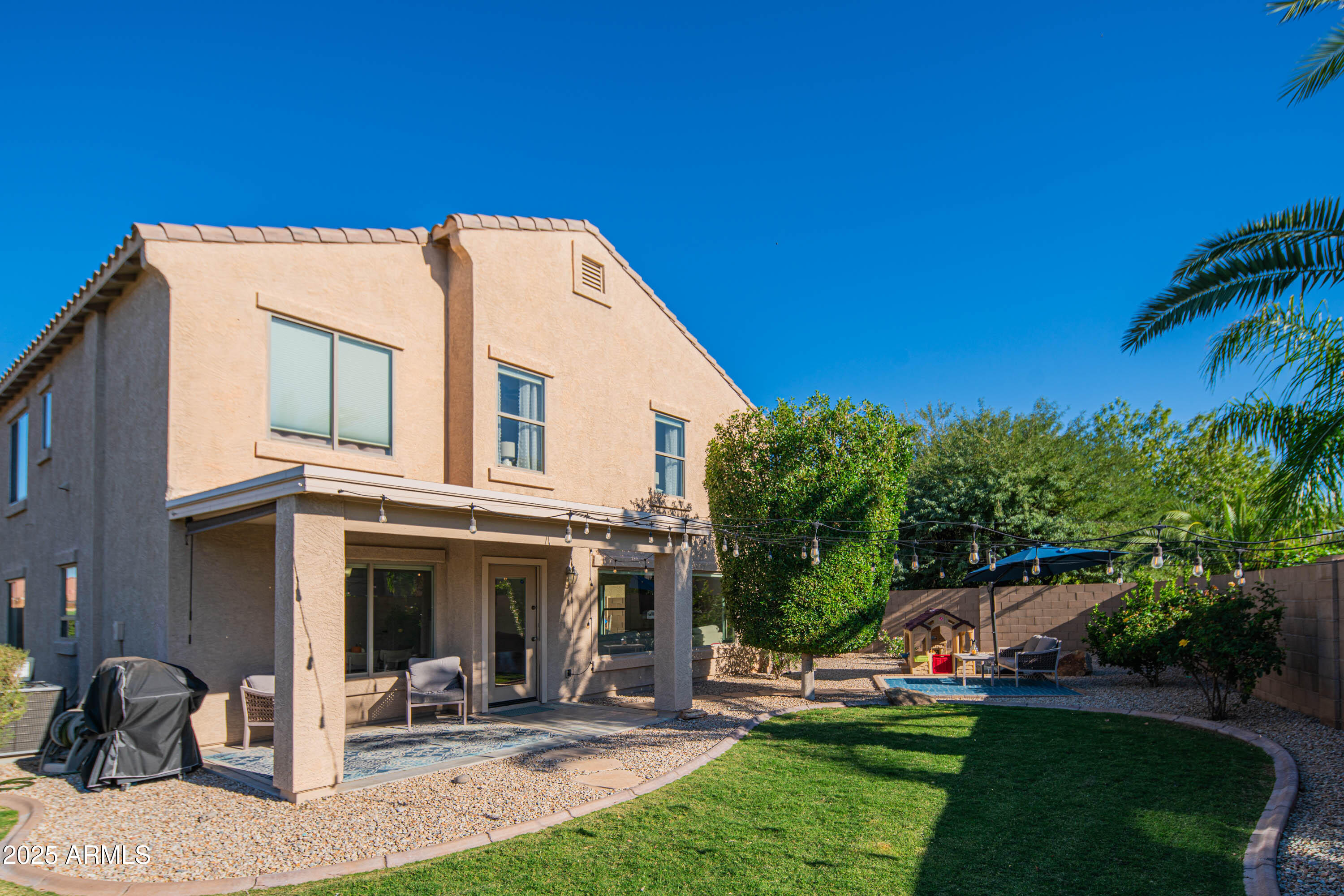 2831 East Jj Ranch Road Phoenix, AZ 85024 - Photo 30 of 32 a view of a house with a yard porch and sitting area