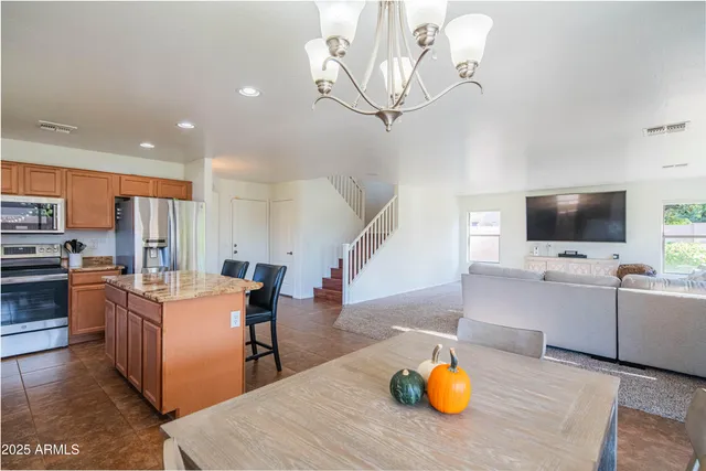 a backyard of a house with outdoor seating