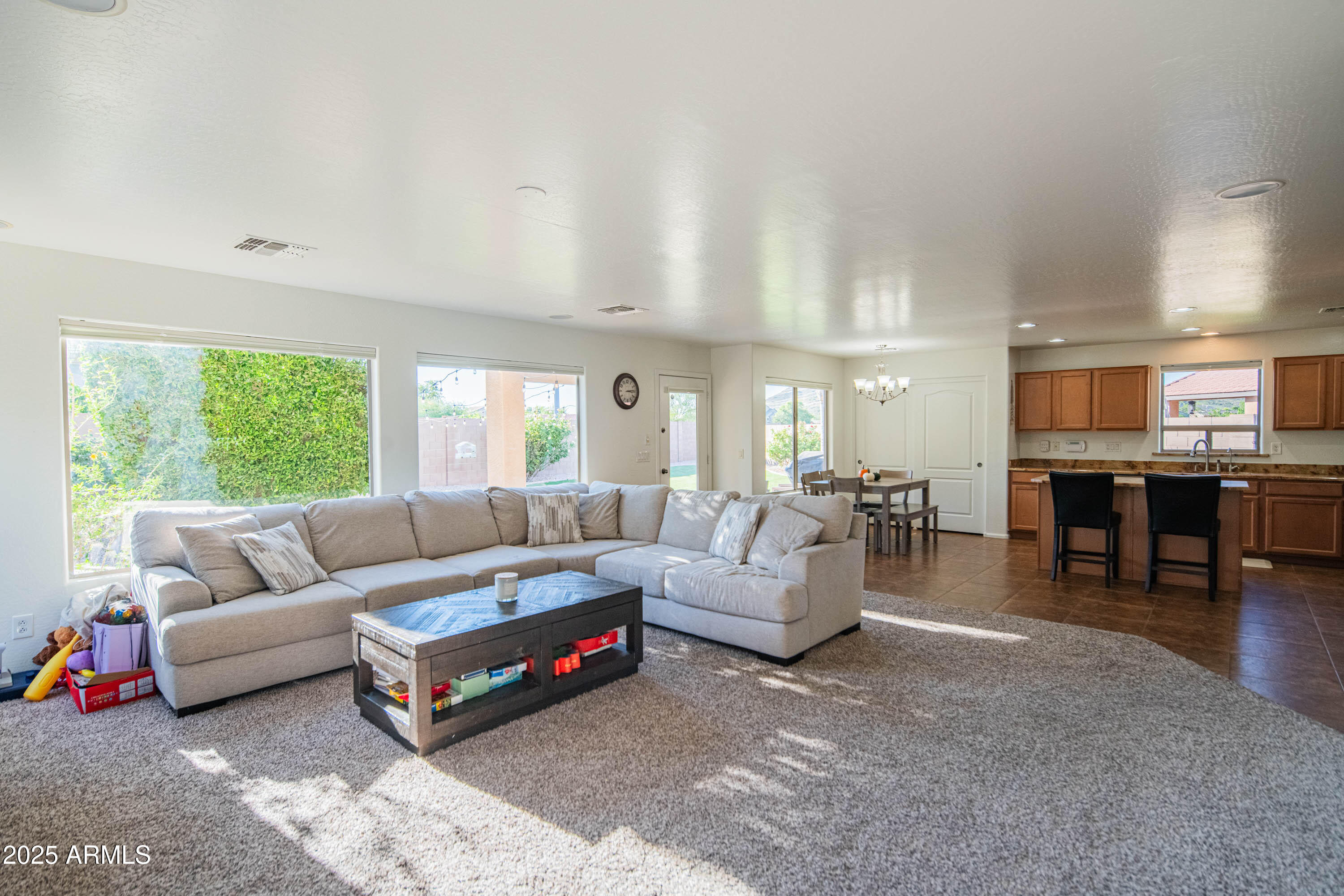 2831 East Jj Ranch Road Phoenix, AZ 85024 - Photo 6 of 32 a living room with furniture and a large window