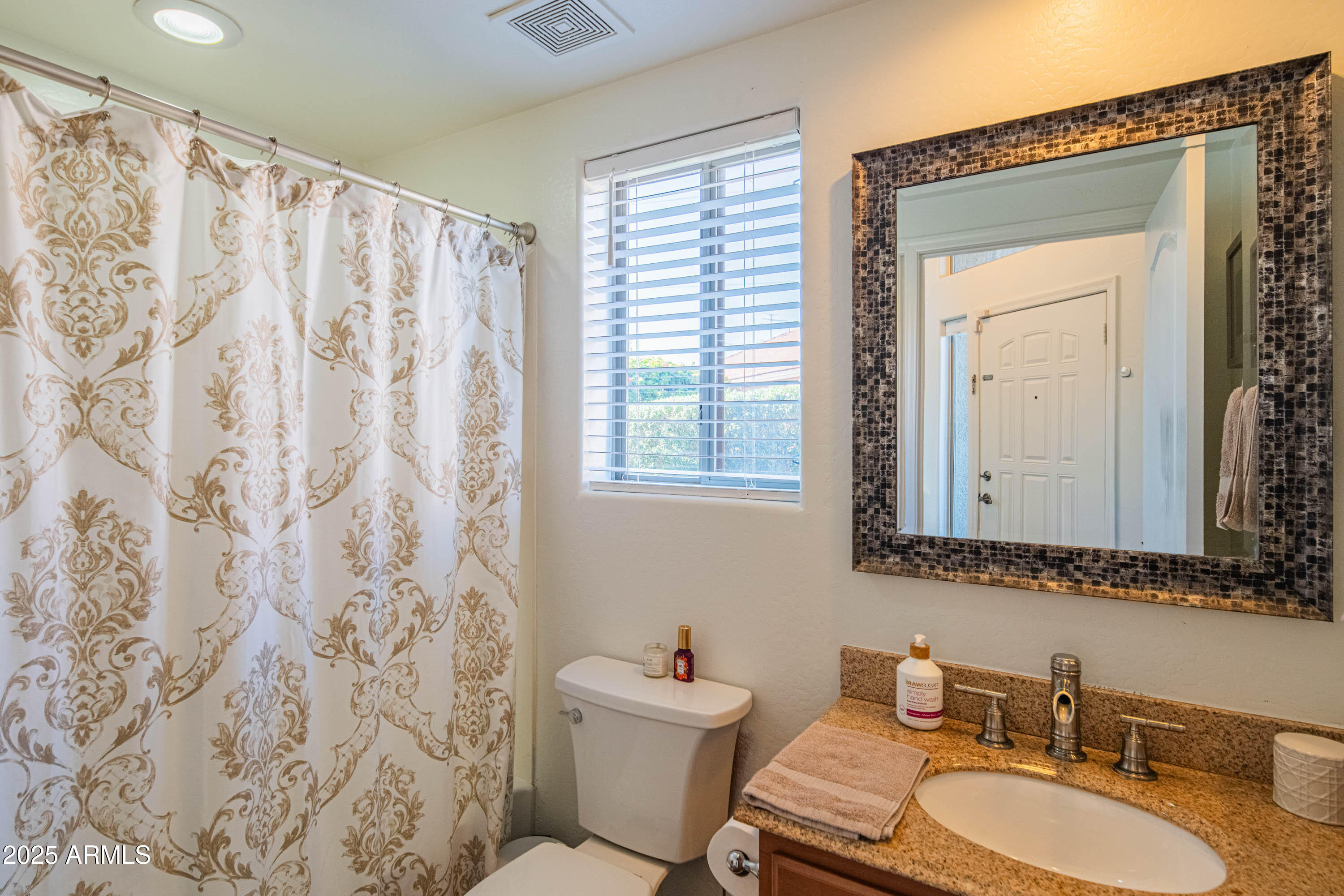 2831 East Jj Ranch Road Phoenix, AZ 85024 - Photo 9 of 32 a bathroom with a sink a toilet and a mirror