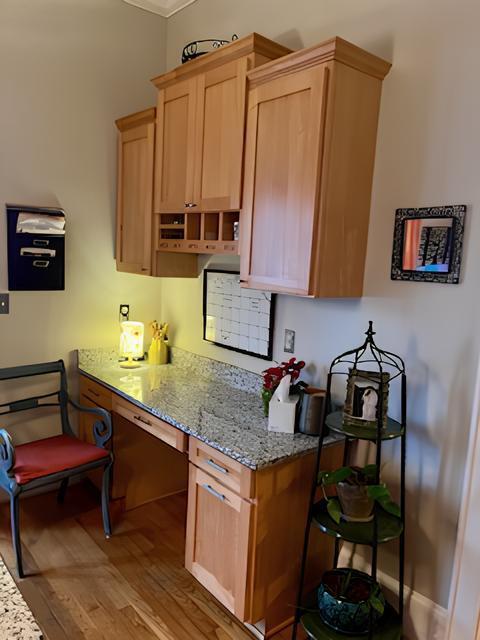 2306 Bedford Avenue Raleigh, NC 27607 - Photo 11 of 18 a kitchen with stainless steel appliances granite countertop a table chairs and a refrigerator