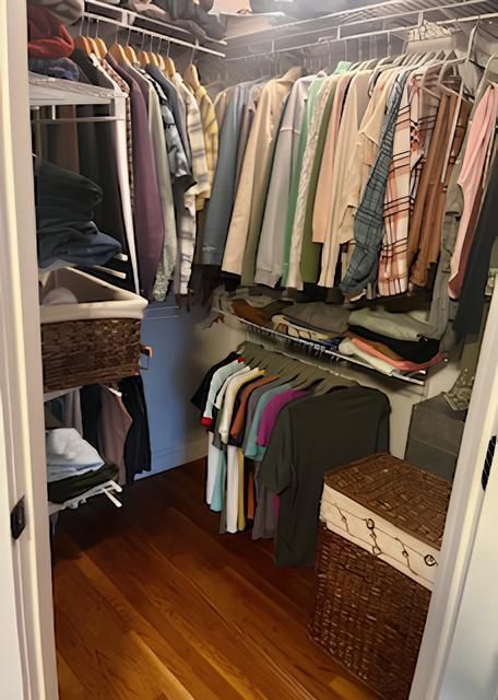 2306 Bedford Avenue Raleigh, NC 27607 - Photo 13 of 18 a view of walk in closet with clothes and shoes