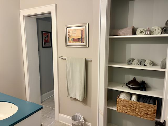 2306 Bedford Avenue Raleigh, NC 27607 - Photo 14 of 18 a shelf with cup and plates