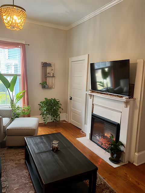 2306 Bedford Avenue Raleigh, NC 27607 - Photo 4 of 18 a living room with furniture and a fireplace