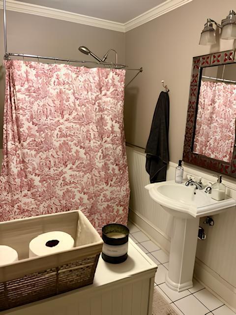 2306 Bedford Avenue Raleigh, NC 27607 - Photo 8 of 18 a bathroom with a sink a toilet and shower