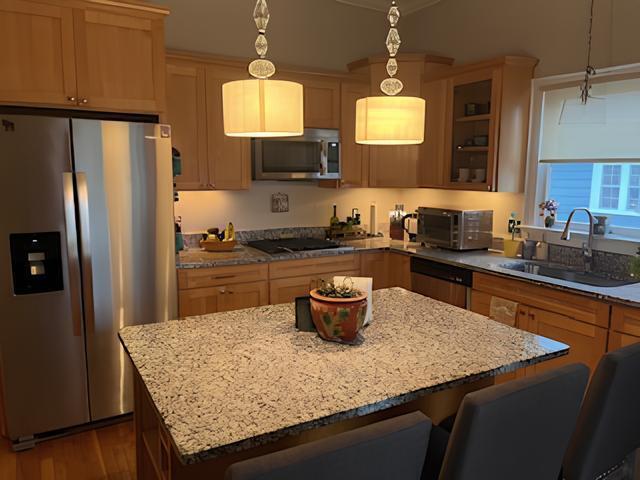 2306 Bedford Avenue Raleigh, NC 27607 - Photo 9 of 18 a kitchen with stainless steel appliances granite countertop a sink dishwasher a refrigerator and a stove