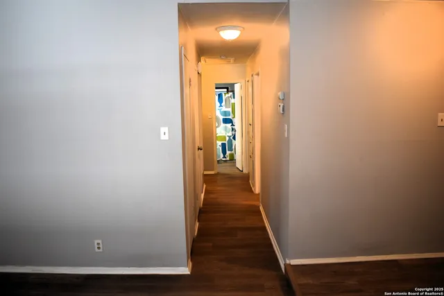 a bathroom with a sink mirror vanity and toilet
