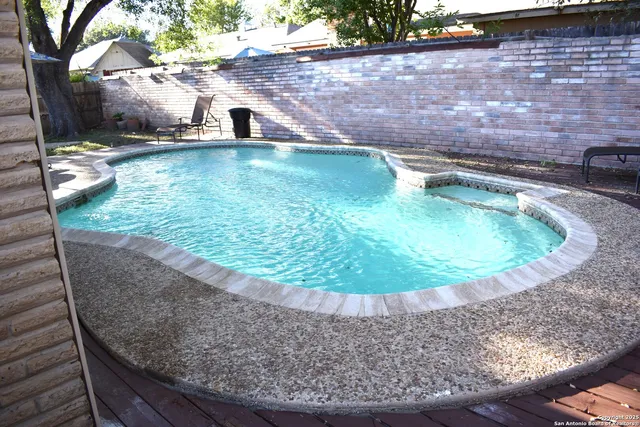 a view of a backyard with sitting area