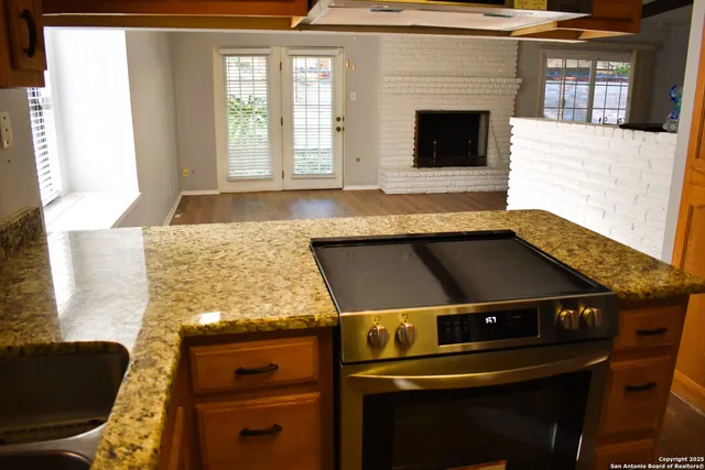 a kitchen with a stove and a microwave