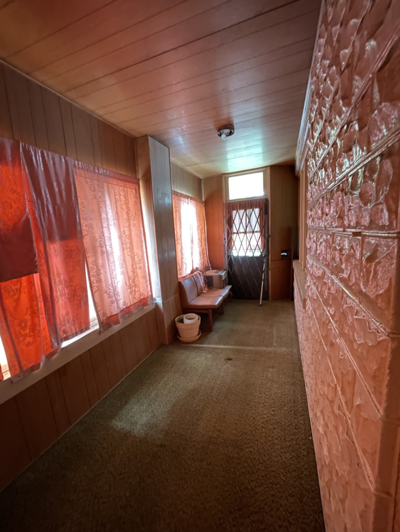11548 South Normal Avenue Chicago, IL 60628 - Photo 4 of 14 a living room with a furniture and a large window