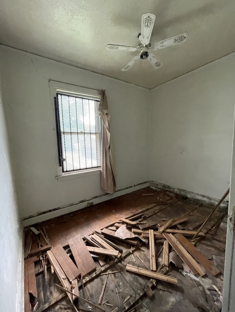 11548 South Normal Avenue Chicago, IL 60628 - Photo 7 of 14 a water heater room with wooden floor