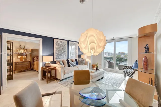 a living room with furniture a fireplace and a large window with garden view