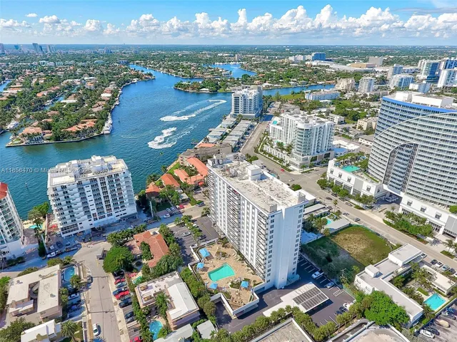 an aerial view of residential building and lake