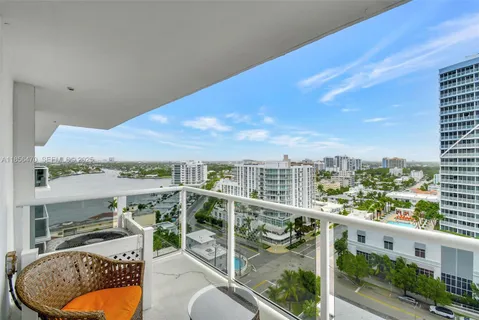 a view of a balcony with furniture