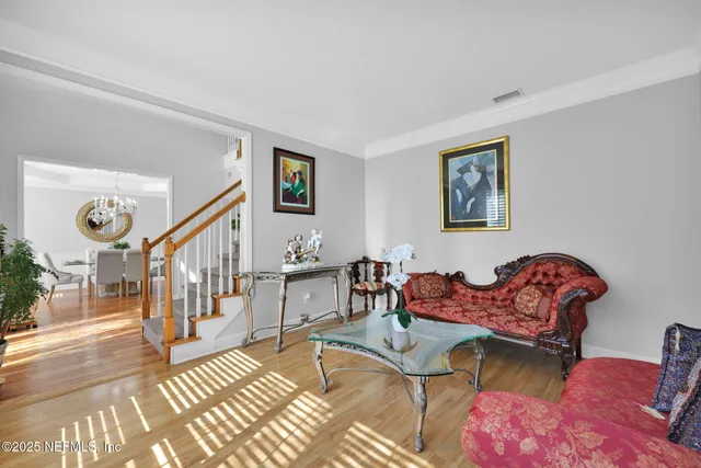 a living room with furniture and a table