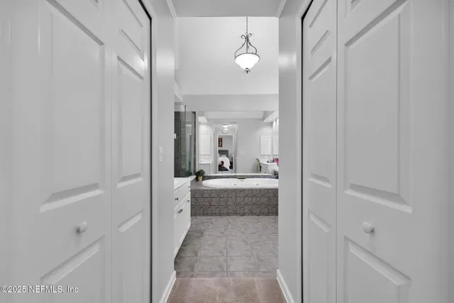 a bathroom with a tub and shower